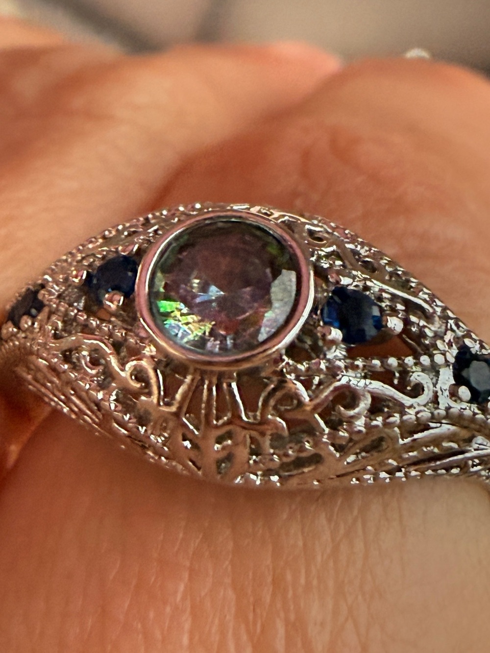Silver Filigree Ring with Blue Accents and I believe Mystic Topaz Center Stone